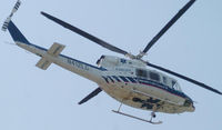 N412LG - 1990 Bell 412 flying over Danville Va. during a mock accident with the Danville Life Saving Crew.. - by Richard T Davis