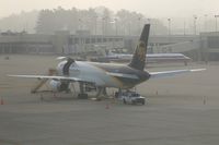 N437UP @ CID - Early morning fog on the UPS ramp.  Fog is clearing