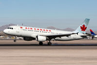 C-FXCD @ LAS - Air Canada C-FXCD touching down on RWY 25L. - by Dean Heald