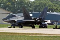 03-4050 @ OSH - EAA AirVenture 2008, the F-22's were parked on the far side of the airfield - by Timothy Aanerud