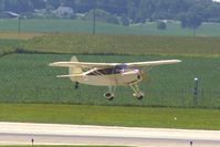 N81207 @ CID - Departing runway 31 after touch and go - by Glenn E. Chatfield