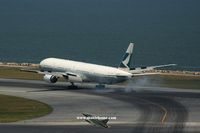 B-HNG @ VHHH - Cathay Pacific touching down on runway 25R - by Michel Teiten ( www.mablehome.com )