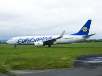 5B-DBU @ EGPF - Eurocypria B737 Taxiing To runway 05 for departure at Glasgow airport - by Mike stanners