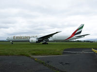 A6-EBZ @ EGPF - Emirates B777 Taxiing out at Glasgow,call sign Emirates 26 - by Mike stanners