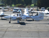 N459TS @ PAO - 2007 Diamond Aircraft Ind Inc DA 42 taxying @ Palo Alto, CA - by Steve Nation