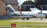N664D @ EGGW - Challenger - still in Ocean Sky livery - at Luton - by Terry Fletcher
