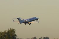N433FX @ CID - FlexJet airborne off Runway 27, not long after sunrise. - by Glenn E. Chatfield