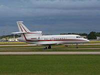 N966H @ ORL - Falcon 900EX with storm in background - by Florida Metal