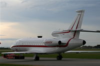 N966H @ ORL - Falcon 900EX with storm in background - by Florida Metal