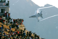 J-5011 @ AXALP - After a strafing run on one of the targets this Hornet disappears behind the mountain. As you can see, we were not alone on the hill top. - by Joop de Groot