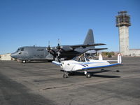 N3378H @ KRNO - With USAF C-130 #1857 @ KRNO - by wftfallon
