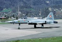 J-3024 @ LSMI - Ready for take off. The barrier in the back is used to close a public road during flight operation.
