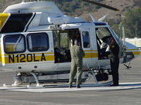 N120LA @ POC - Fueling pilots for fire fighting flights - by Helicopterfriend