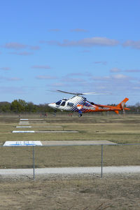 N144CF @ 3XS7 - Texas Motor Speedway Heliport - CareFlite N144CF landing during the Boy Scout Camporee