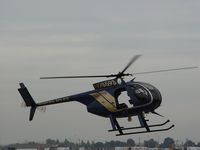 N98593 @ POC - Entering Pomona PD fenced heliport area at Brackett - by Helicopterfriend