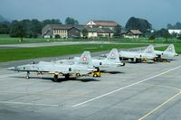 J-3052 @ LSMF - During the annual refresher course these Tigers are waiting for yet another mission. In the background the usual net barrier. It was not until the arrival of the Hornet that Switzerland introduced arrester cables.
