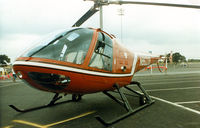 N86239 @ TX08 - Enstrom 280X at a Helicopter show in the former Texas Rangers baseball stadium parking lot.