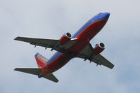 N324SW @ IAD - Boeing 737-3H4 N324SW takes off from Dulles