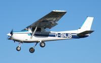 G-BNJB @ EGSF - Locally-based Cessna 152 landing at Conington - by Simon Palmer