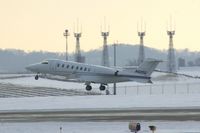N425G @ CID - Departing runway 13.  Background are the tower's communications antennae