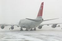 N673US @ CID - NWA9840 parked the cargo ramp.  Seen from my 2nd floor office window, very snowy - by Glenn E. Chatfield