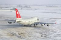 N673US @ CID - NWA9980 taxiing to Runway 27.  Wind 280@25-30 kt - by Glenn E. Chatfield