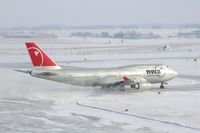 N673US @ CID - NWA9980 taxiing to Runway 27, on taxiway Alpha 5.  Wind 280@25-30 kt and I'm outside on the tower catwalk - by Glenn E. Chatfield