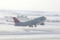 N673US @ CID - NW9980 about 4000 feet down the runway and airborne.  Wind 280@25-30 kts.  I'm glad I have my parka on! - by Glenn E. Chatfield