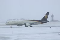 N414UP @ CID - Taxiing to cargo ramp via Alpha.  Early morning in the snow.