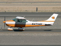 N4734N @ KDVT - Taxiing past the terminal - by John Meneely