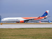 OY-VKG @ EGCC - Garuda Indonesian Airlines - by chris hall