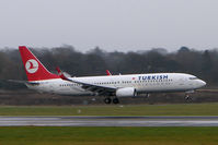 TC-JGH @ EGCC - THY Boeing 737-400 touches down on a typically gloomy Manchester day - by Terry Fletcher