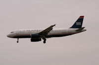 N605AW @ DFW - US Airways landing at DFW on a cold gray day. - by Zane Adams
