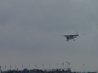 N1057Z @ POC - On final passing under and in front of Goodyear Blimp - by Helicopterfriend