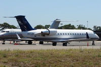 VH-LEF @ YSSY - Executive Challenger 850 at Sydney