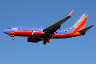 N203WN @ LAS - Southwest Airlines N203WN (FLT SWA2526) from Orlando Int'l (KMCO) on short-final to RWY 25R. - by Dean Heald