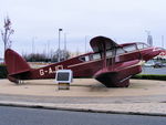 BAPC280 @ EGGP - Replica of a Dragon Rapide on display in front of the old Liverpool Airport, it used to wear the reg number G-ANZP - by Chris Hall