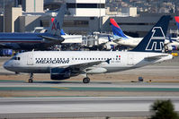 XA-UBU @ LAX - Mexicana XA-UBU (FLT MXA912) from Guadalajara, Mexico Don Miguel Hidalgo Y Costilla Int'l (MMGL) on the high-speed taxiway after arrival on RWY 25L. - by Dean Heald