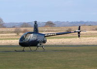 G-OAVA @ EGHO - ONE OF THREE R22'S OUTSIDE FAST HELICOPTERS HANGER - by BIKE PILOT