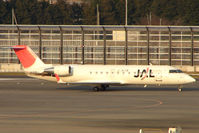 JA205J @ RJAA - J-Air CLRJ at Narita - by Terry Fletcher