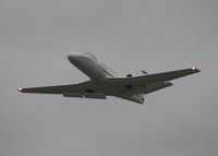 N550CZ @ DTN - Taking off from runway 32 at the Shreveport Downtown airport on an nasty overcast, windy day.