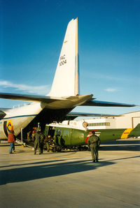 FAC1004 @ GKY - Colombian Air Force C-130 at Arlington - picking up N667GH - Huey 800 prototype