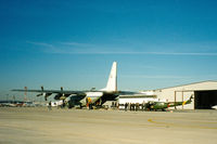 FAC1004 @ GKY - Colombian Air Force C-130 at Arlington - picking up N667GH - Huey 800 prototype