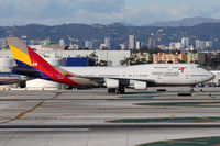 HL7423 @ LAX - Taxiing to the gate after arrival on the North Complex. - by Dean Heald