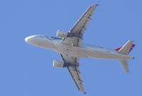 N321NB @ KSNA - NWA A318 Climbing the blue sky - by Mike Khansa