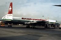HB-IEO @ LGW - CL-44 of Swiss cargo airline Transvalair at London Gatwick in the Autumn of 1978. - by Peter Nicholson