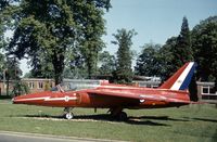 XR571 - Gnat T.1 in Red Arrows colour scheme as gate guardian at RAF Brampton in the Summer of 1978. - by Peter Nicholson