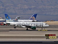 N909FR @ KLAS - Frontier Airlines - 'Lucy - Canada Goose' (Retired) / 2002 Airbus A319-111 - by Brad Campbell