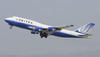 N117UA @ KLAX - Departing LAX on 25R - by Todd Royer