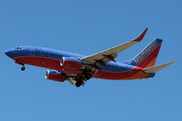 N797MX @ KRNO - Looking a bit faded, this Southwest 737 glides toward touchdown on RNO's runway 16R. - by Gary Schenauer